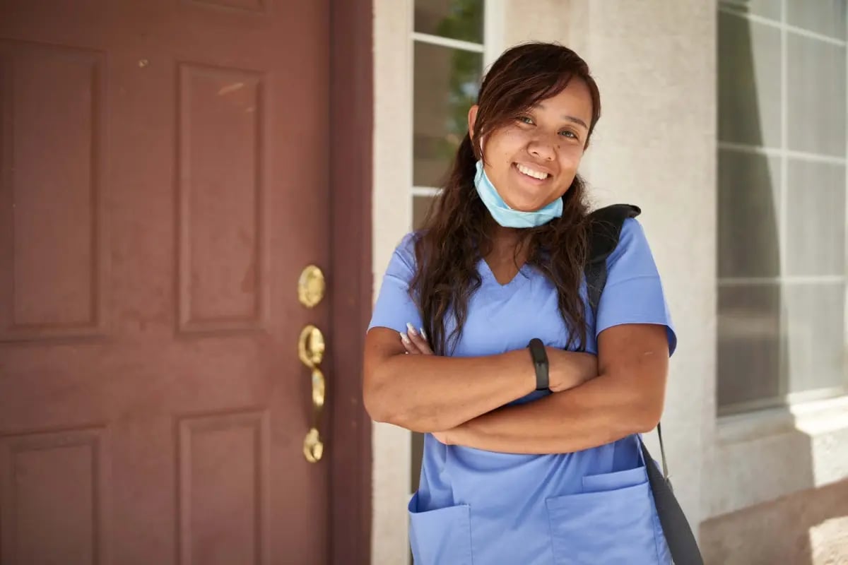 nurse-stood-outside-house